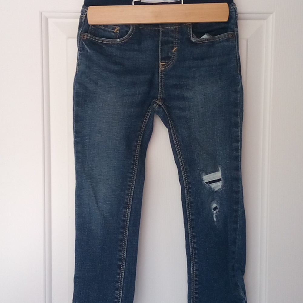 Dark wash jeans with destressing
